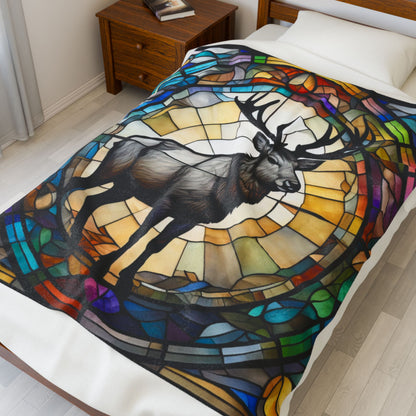 A reindeer blanket with stained glass-style art that adds warmth and festive woodland flair.
