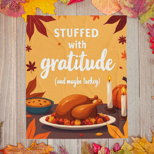 Funny Thanksgiving blanket with “Stuffed with Gratitude (and Maybe Turkey),” warm festive fall design.