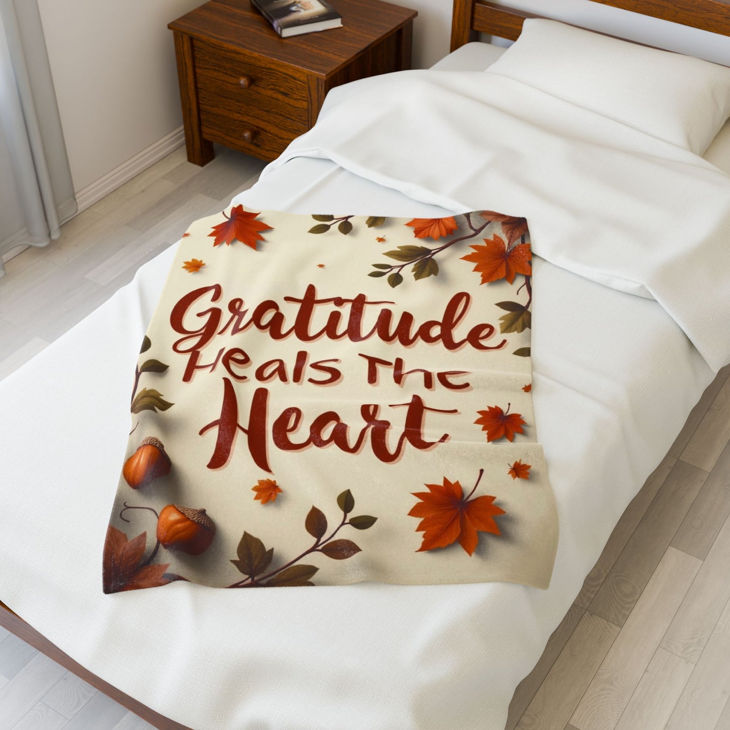 Cozy blanket reading “Gratitude Heals the Heart,” autumn mindfulness design promoting warmth and peace.