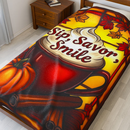 Cozy fall blanket with “Sip, Savor, Smile,” warm orange tones and autumn mindfulness aesthetic.