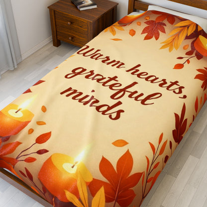 Cozy fall blanket with “Warm Hearts, Grateful Minds,” mindfulness-inspired autumn home décor.