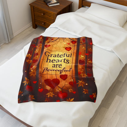 Warm blanket with “Grateful Hearts Are Peaceful,” Thanksgiving gratitude design in soft autumn hues.