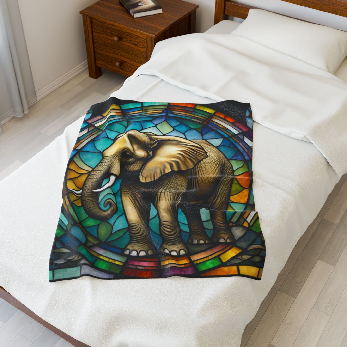 A calming elephant blanket featuring stained glass-inspired design and soothing colors.
