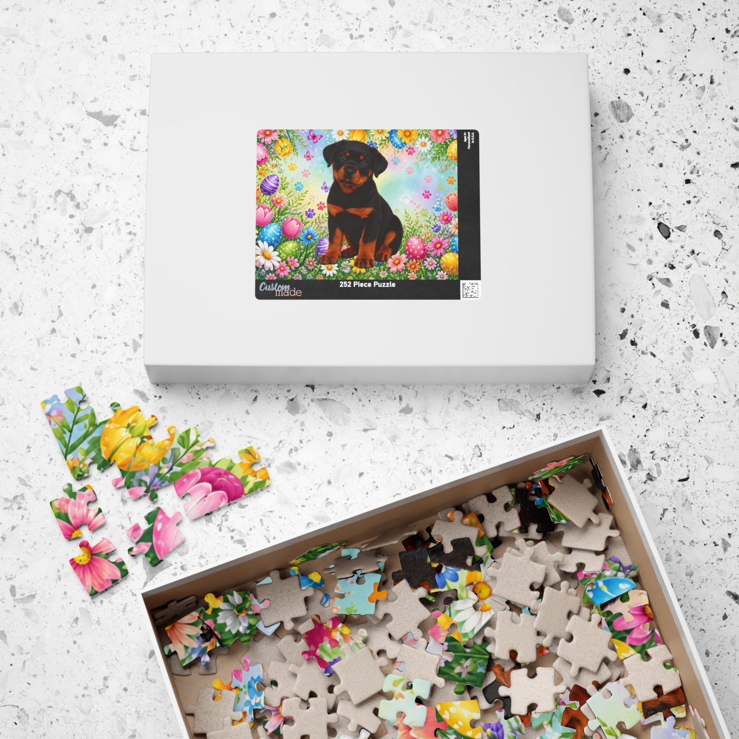 Rottweiler (Black & Rust) Easter Puppy Puzzle - Spring Garden with Eggs, Tulips, and Daisies