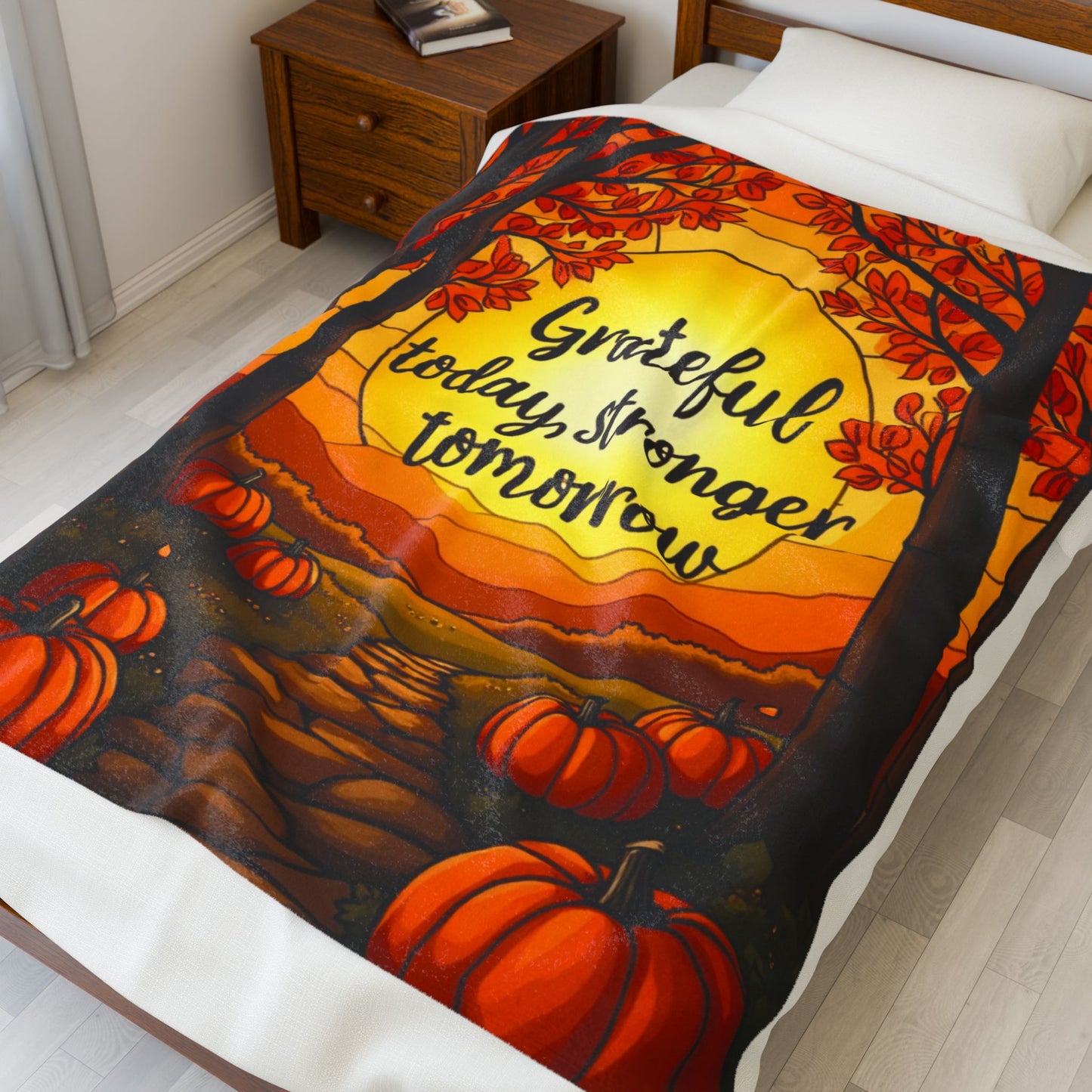 Motivational blanket with “Grateful Today, Stronger Tomorrow,” positive fall mindfulness message.
