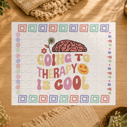 Jigsaw puzzle with colorful design and text 'Going to therapy is cool' on a white background