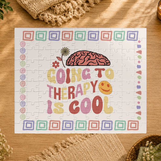 Jigsaw puzzle with colorful design and text 'Going to therapy is cool' on a white background