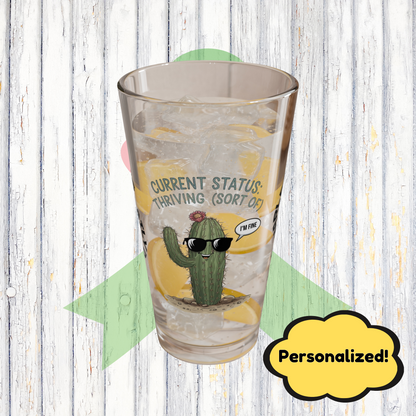 "Current Status: Thriving (Sort Of)" personalized funny pint glass with attitude and daily humor.