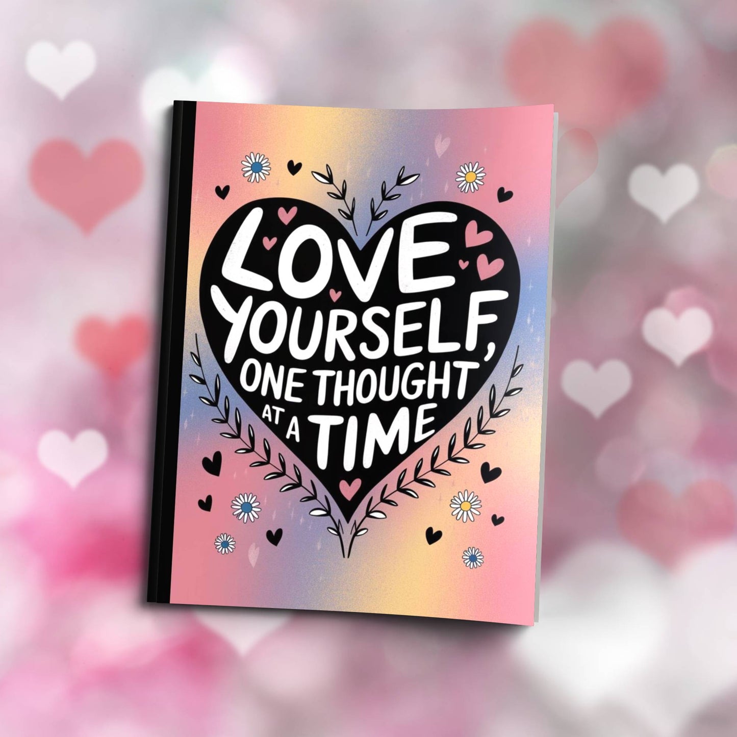 Paperback journal "Love Yourself One Thought At A Time" with uplifting cover, designed for mindfulness, self-care, and personal growth.