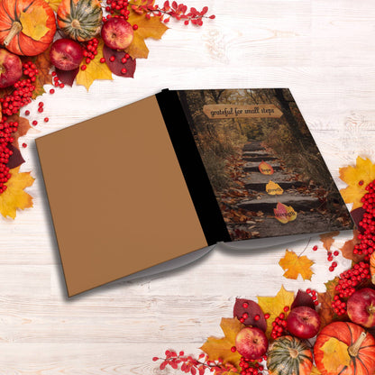 Grateful For Small Steps paperback composition notebook for gratitude journaling and reflection.