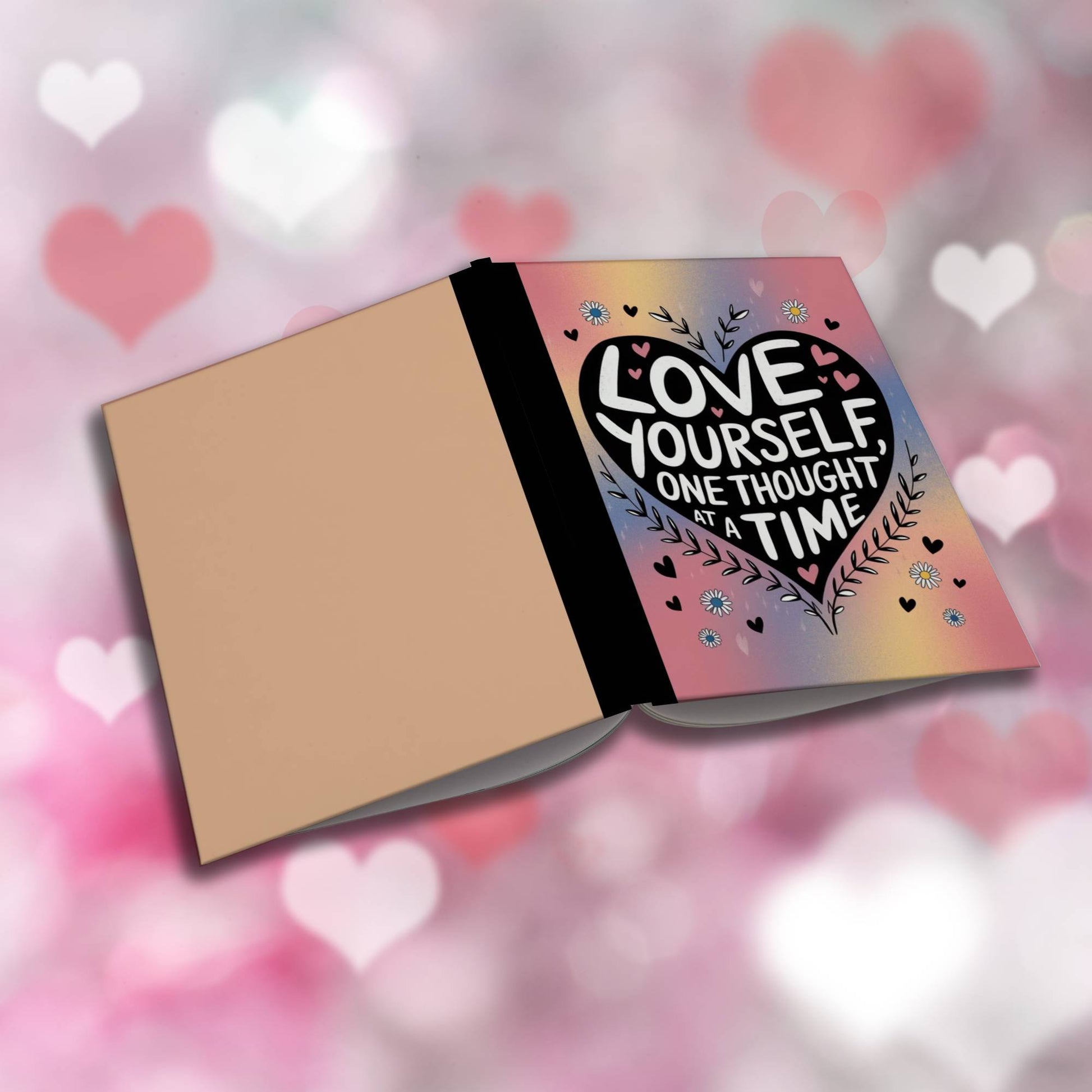Paperback journal "Love Yourself One Thought At A Time" with uplifting cover, designed for mindfulness, self-care, and personal growth.