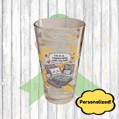 "I’m In A Relationship With My Bed" personalized funny pint glass with attitude and daily humor for sleep lovers.