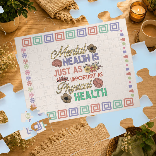 Jigsaw puzzle with motivational quote on a wooden table with decorative items.