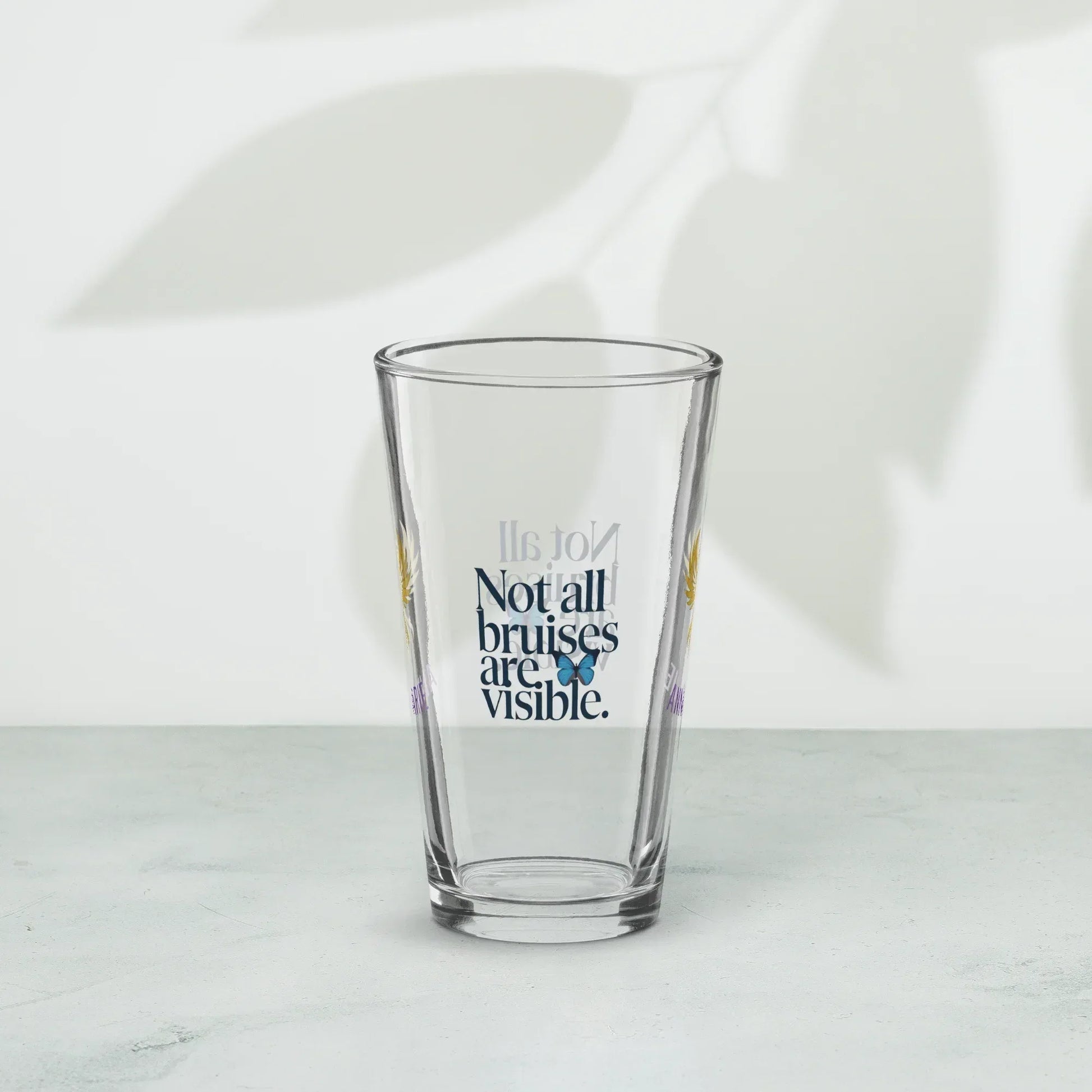 Shop our premium rise reclaim pint glass not all bruises from MySisterIsASurvivor.