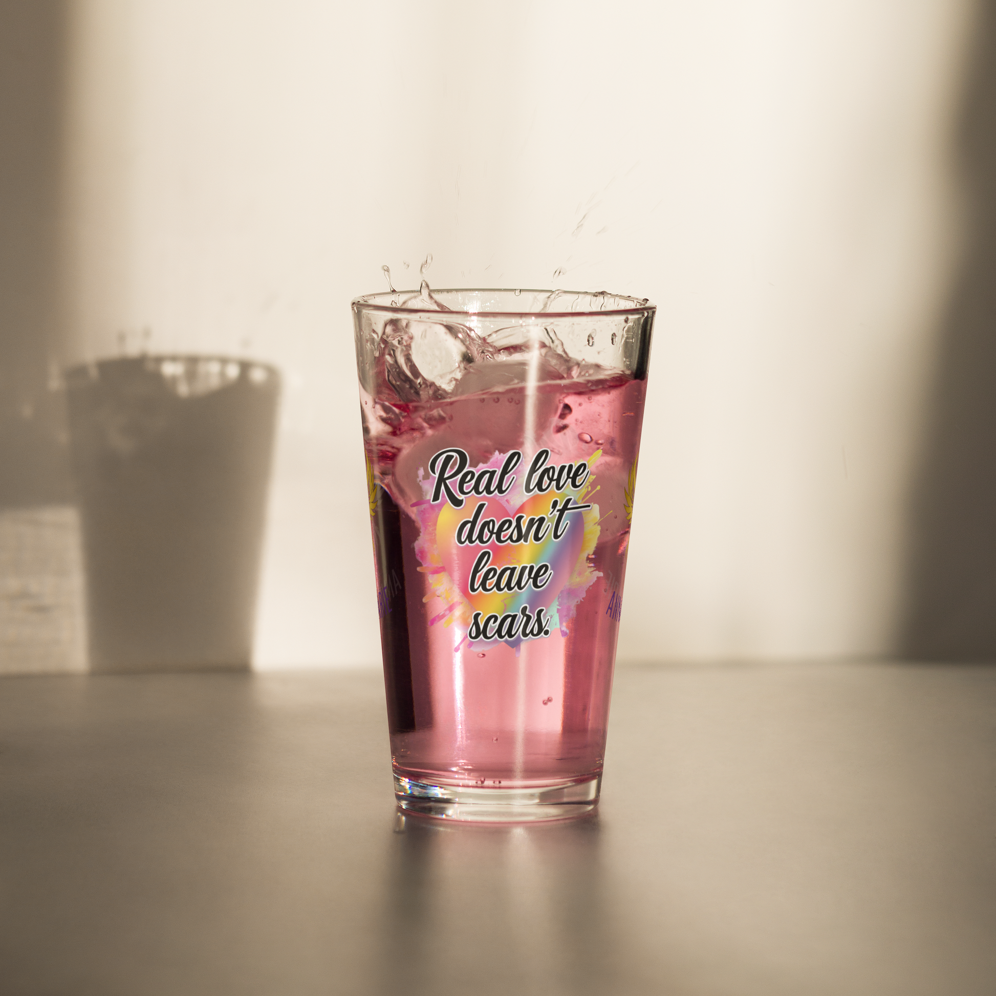 Real Love Doesn’t Leave Scars pint glass, domestic violence advocacy drinkware, survivor empowerment quote