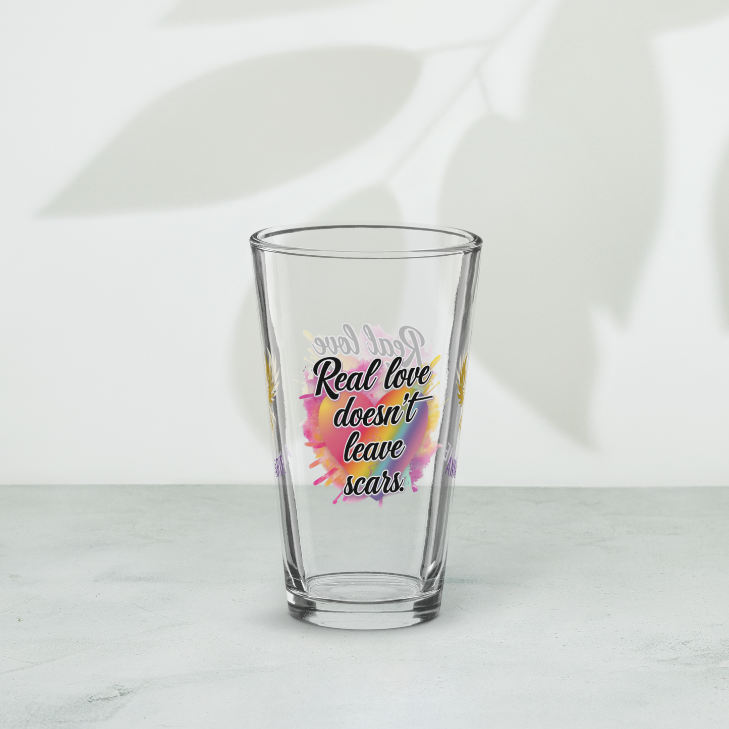 Real Love Doesn’t Leave Scars pint glass, domestic violence advocacy drinkware, survivor empowerment quote