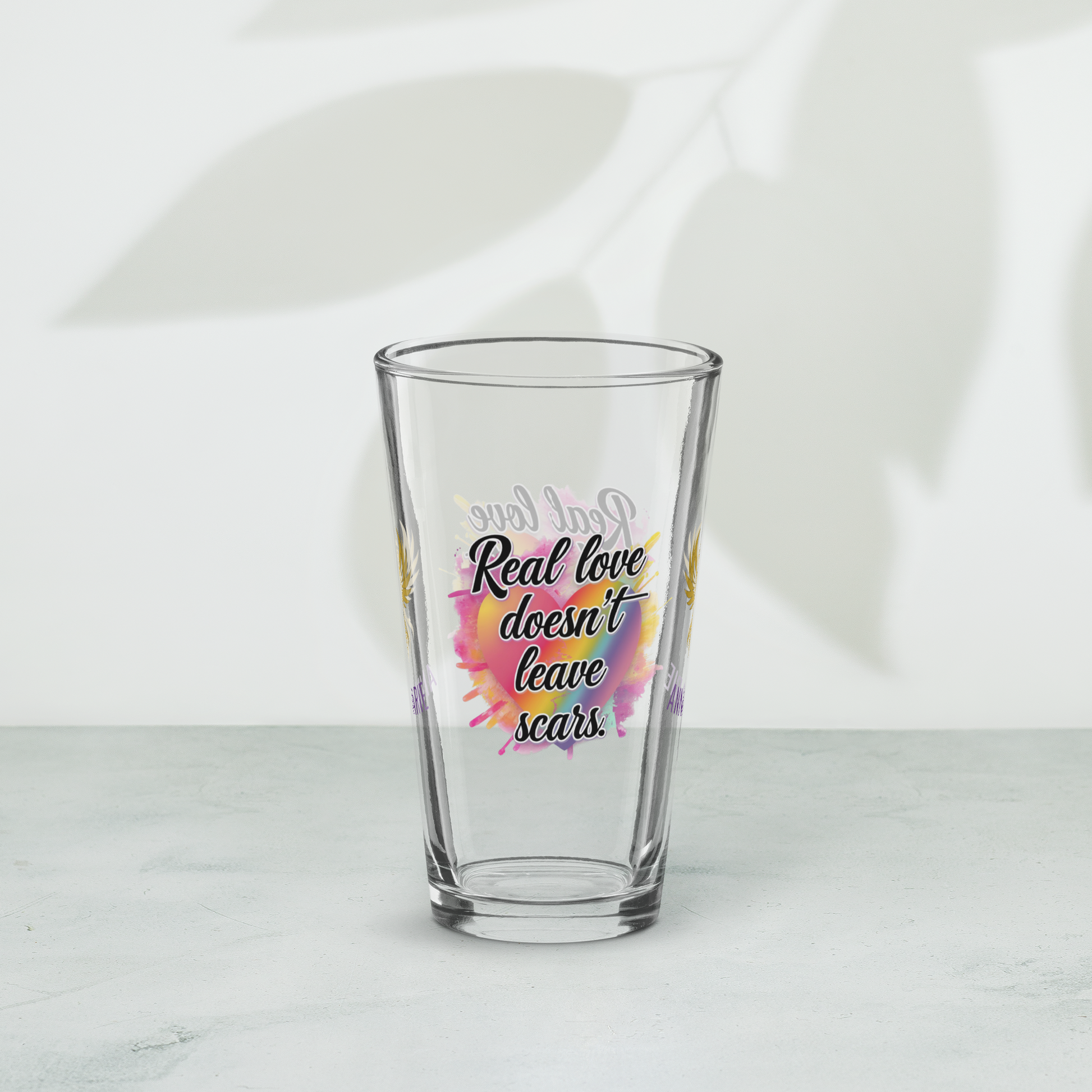 Real Love Doesn’t Leave Scars pint glass, domestic violence advocacy drinkware, survivor empowerment quote