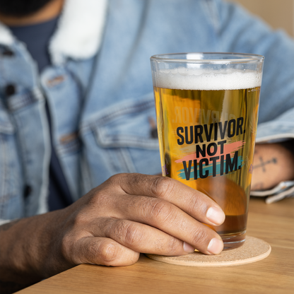 Survivor Not Victim pint glass, empowering quote design, trauma recovery awareness gift