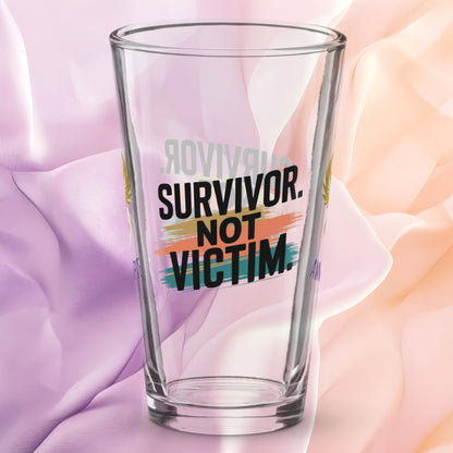 Survivor Not Victim pint glass, empowering quote design, trauma recovery awareness gift