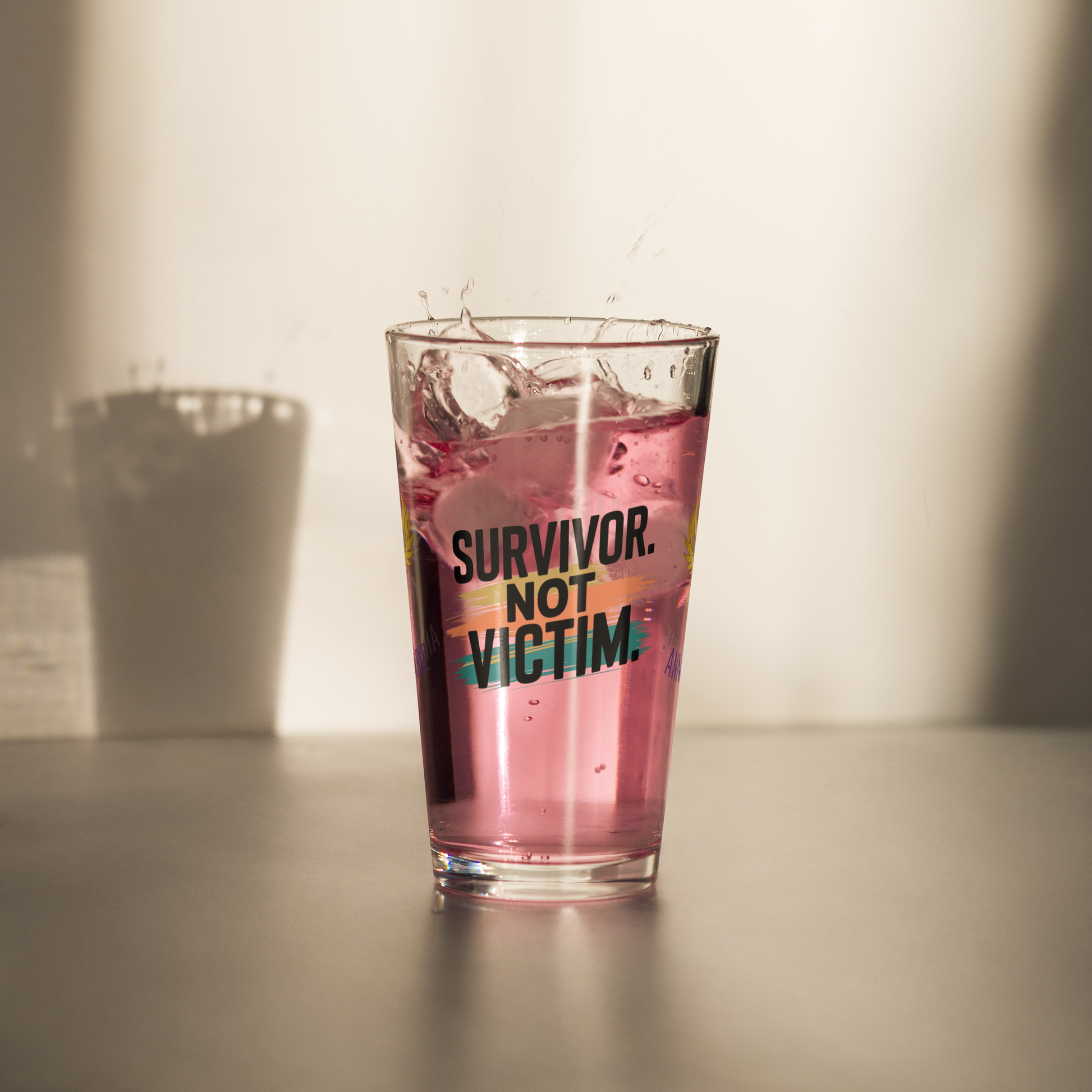 Survivor Not Victim pint glass, empowering quote design, trauma recovery awareness gift