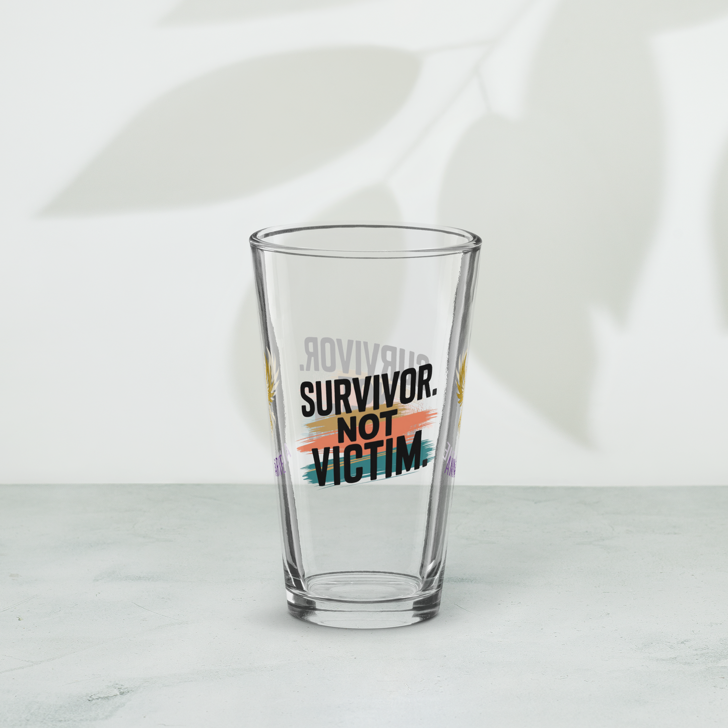 Survivor Not Victim pint glass, empowering quote design, trauma recovery awareness gift