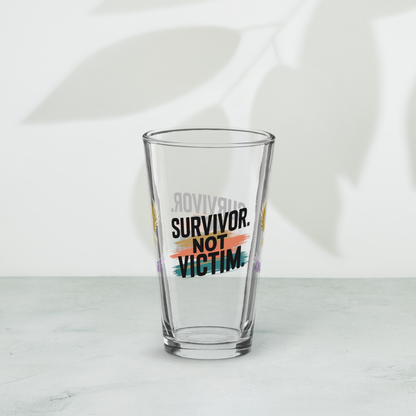 Survivor Not Victim pint glass, empowering quote design, trauma recovery awareness gift