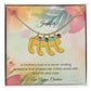 A Mother's Love Is a Never-Ending Embrace - Engraved Baby Feet Necklace with Birthstone