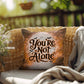 Indoor/outdoor mental health pillow with “You’re Not Alone” to promote comfort and support