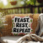 Feast, Rest, Repeat pillow featuring mindfulness message with cozy Thanksgiving and fall décor vibes