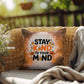 Indoor/outdoor throw pillow with “Stay Kind To Your Mind” promoting mental wellness