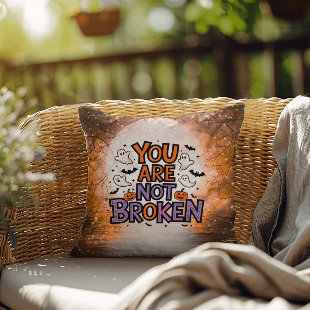 Indoor/outdoor pillow with “You Are Not Broken” for mental health awareness