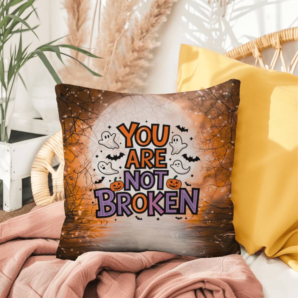 Indoor/outdoor pillow with “You Are Not Broken” for mental health awareness