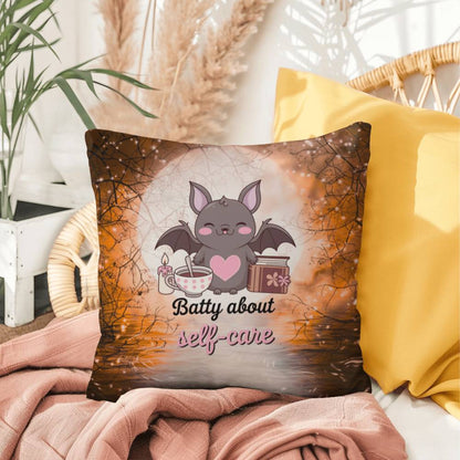 Halloween indoor/outdoor throw pillow with bats and “Batty About Self-Care” for mental health encouragement