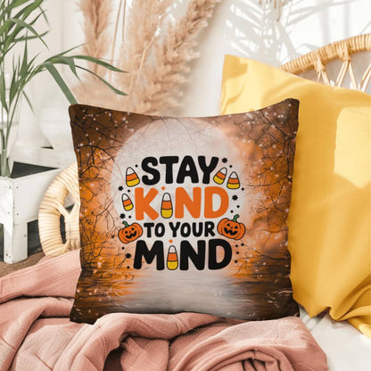 Indoor/outdoor throw pillow with “Stay Kind To Your Mind” promoting mental wellness