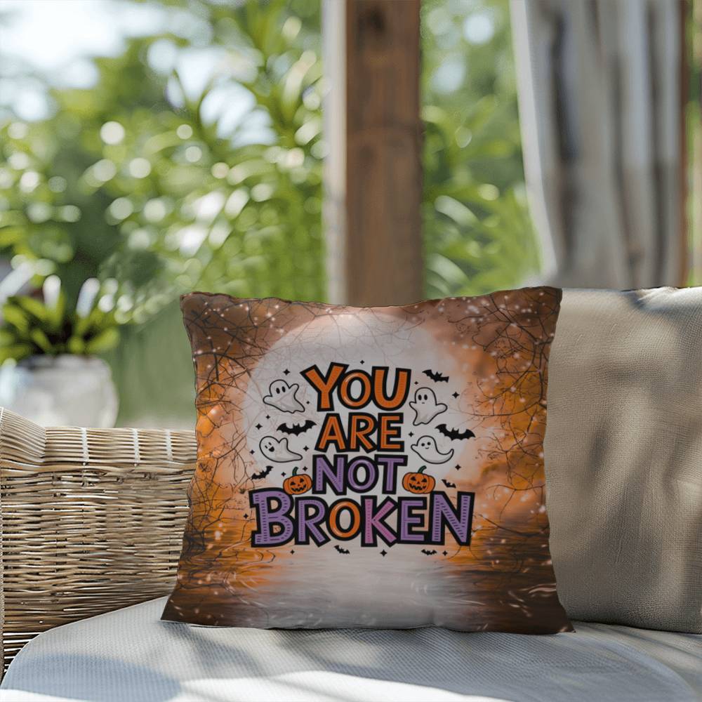 Indoor/outdoor pillow with “You Are Not Broken” for mental health awareness