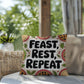 Feast, Rest, Repeat pillow featuring mindfulness message with cozy Thanksgiving and fall décor vibes