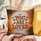 Mental health indoor/outdoor pillow with “You Are Loved” for comforting décor