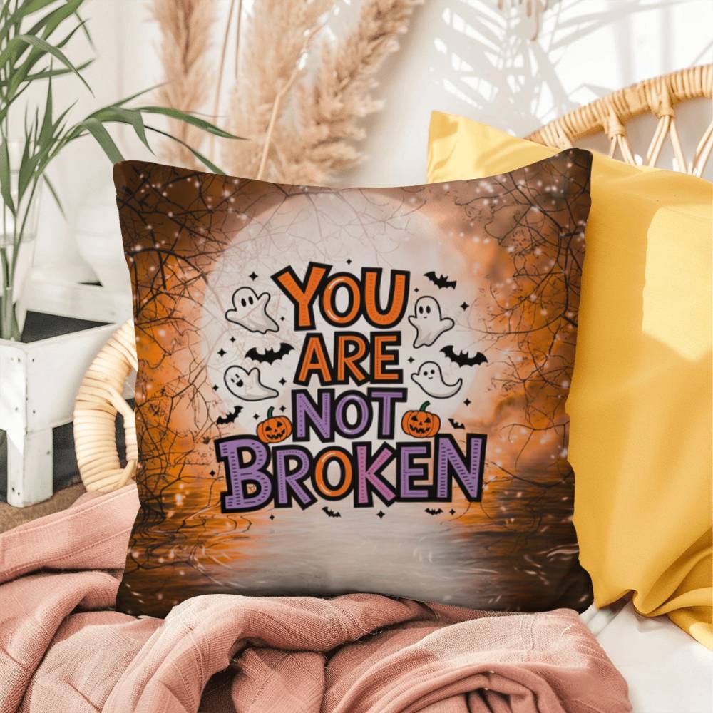 Indoor/outdoor pillow with “You Are Not Broken” for mental health awareness