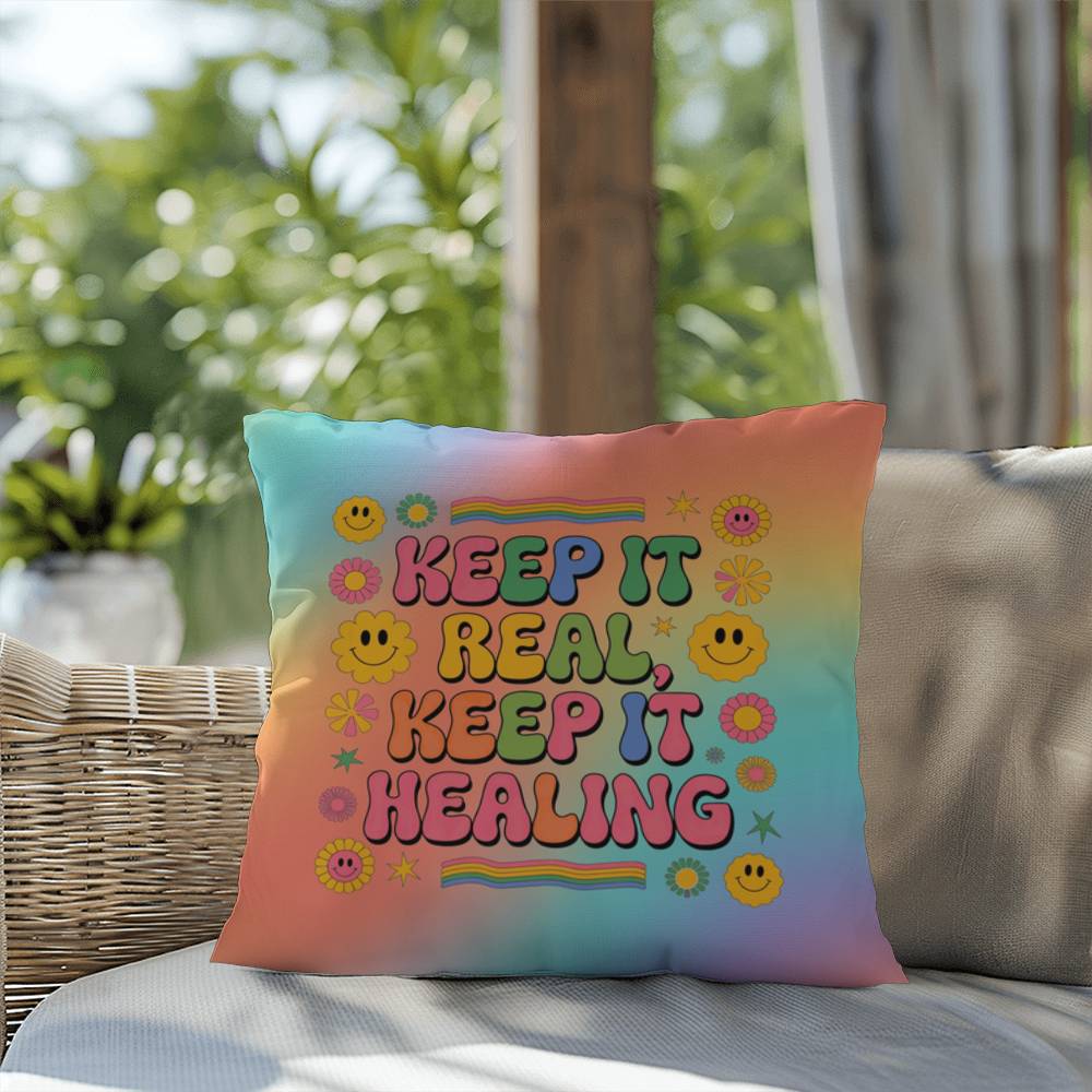 Custom pillow with “Keep It Real, Keep It Healing” in fun vintage font, for authenticity and support in therapy or wellness spaces