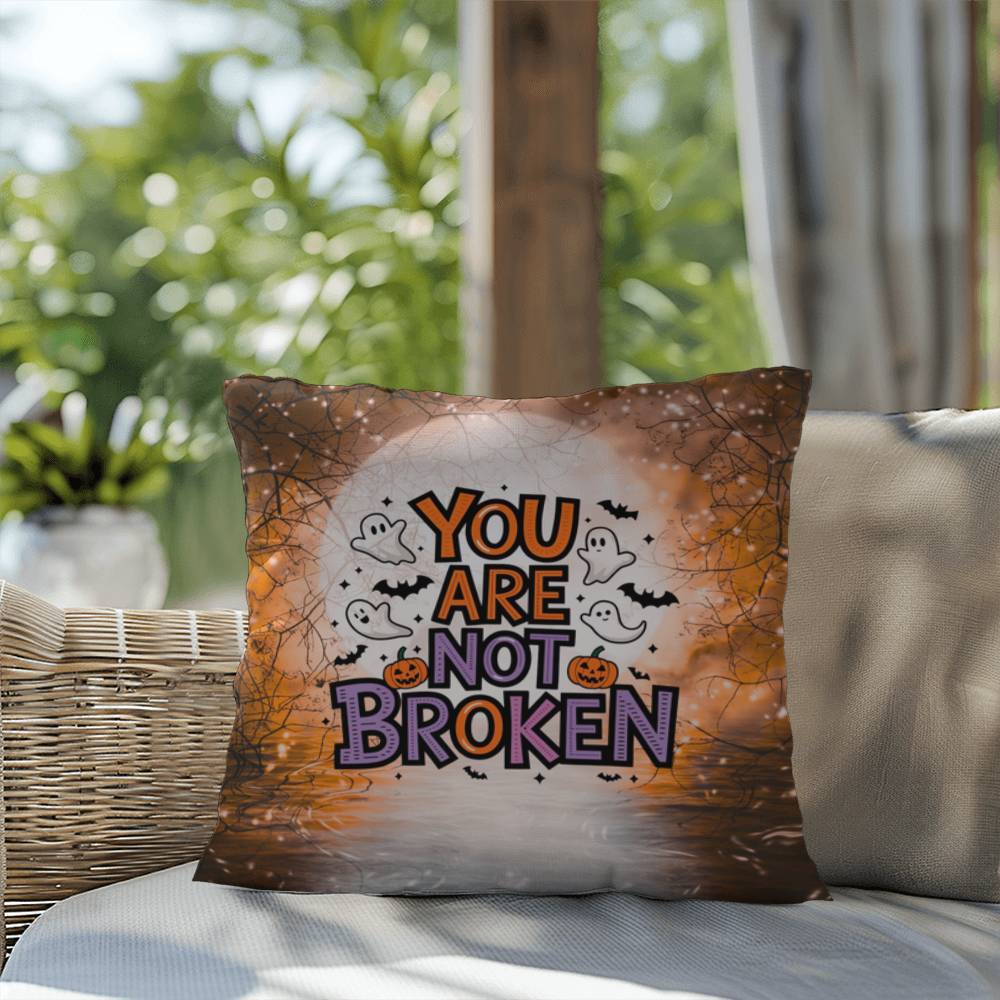 Indoor/outdoor pillow with “You Are Not Broken” for mental health awareness