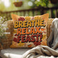 Breathe, Relax, Feast! pillow in fall colors with Thanksgiving mindfulness quote for cozy home spaces
