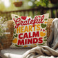 Grateful Hearts, Calm Minds pillow in bright fall tones with Thanksgiving gratitude and mindfulness quote