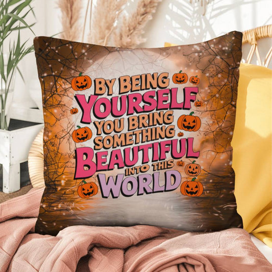 Inspirational indoor/outdoor throw pillow with “By Being Yourself” for mental health awareness