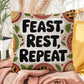 Feast, Rest, Repeat pillow featuring mindfulness message with cozy Thanksgiving and fall décor vibes
