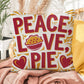 Peace, Love, Pie throw pillow with colorful fall design and mindfulness quote for seasonal comfort