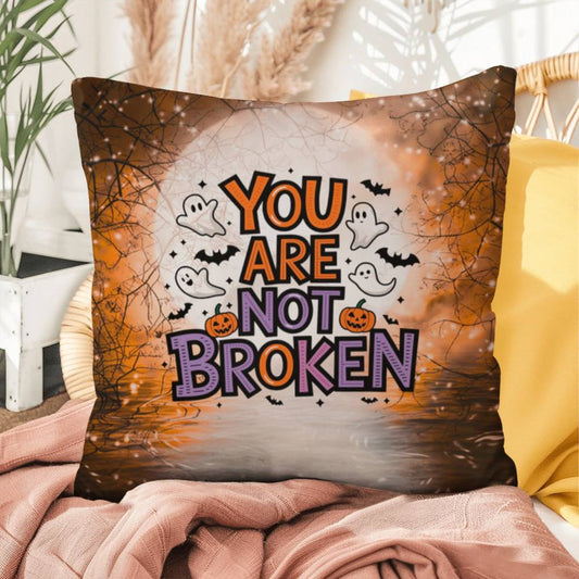 Indoor/outdoor pillow with “You Are Not Broken” for mental health awareness