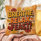 Breathe, Relax, Feast! pillow in fall colors with Thanksgiving mindfulness quote for cozy home spaces