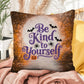 Inspirational Halloween indoor/outdoor pillow featuring “Be Kind To Yourself” for self-care and positivity
