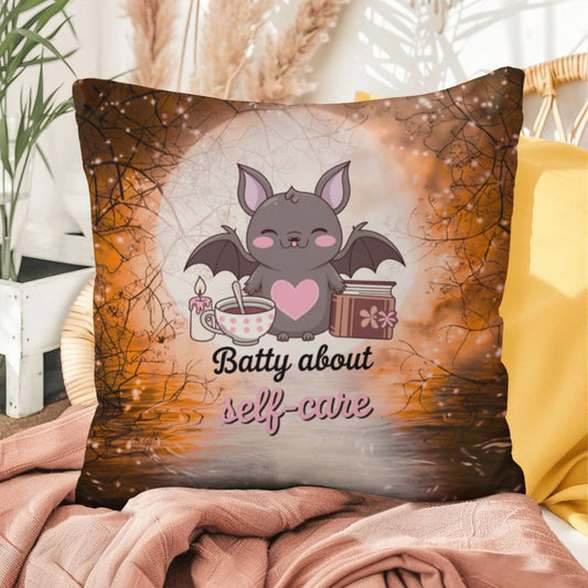 Halloween indoor/outdoor throw pillow with bats and “Batty About Self-Care” for mental health encouragement