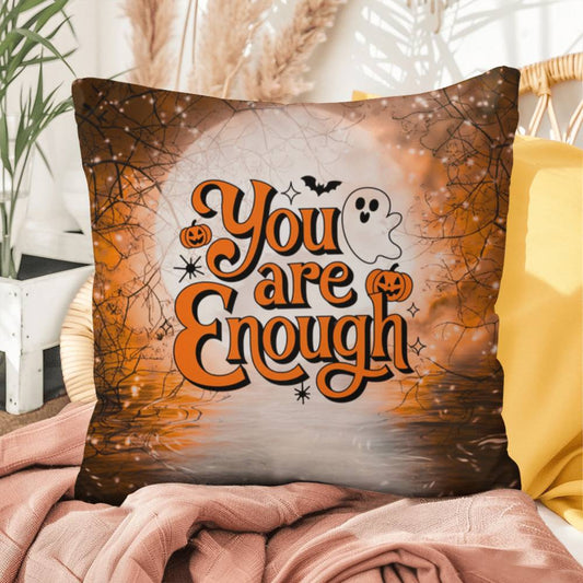 Indoor/outdoor pillow with “You Are Enough” promoting self-love and mental health